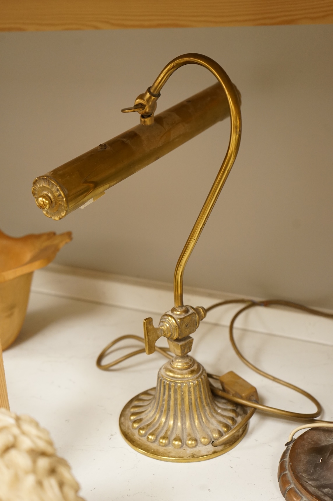 A copper table lamp and a brass students lamp